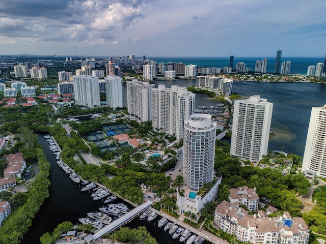 birds eye view of property with a view of city and a water view