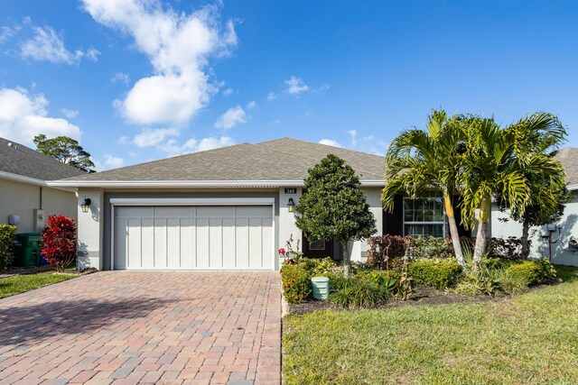 single story home featuring a garage