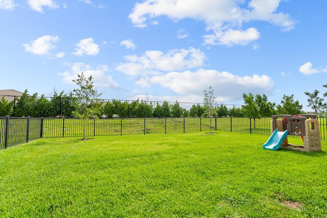 view of yard featuring fence private yard and a playground