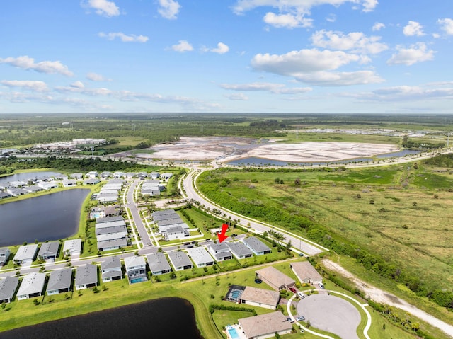 aerial view featuring a residential view and a water view