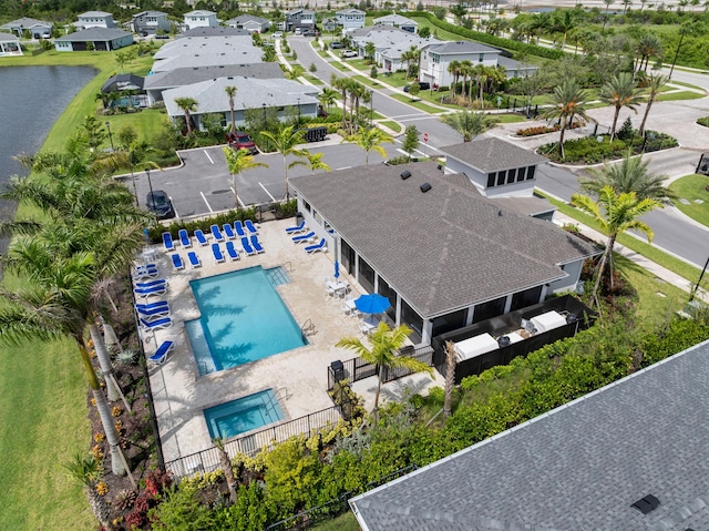 aerial view with a residential view and a water view