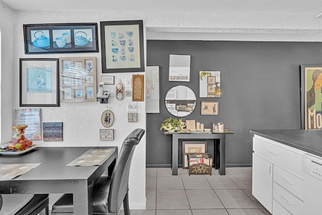 office space with light tile patterned floors and a textured ceiling