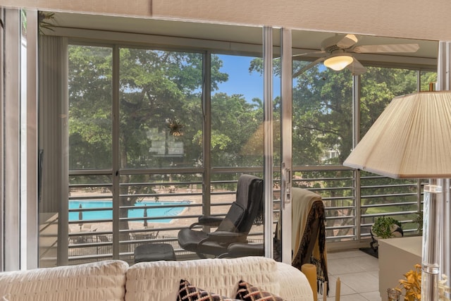 sunroom / solarium with ceiling fan