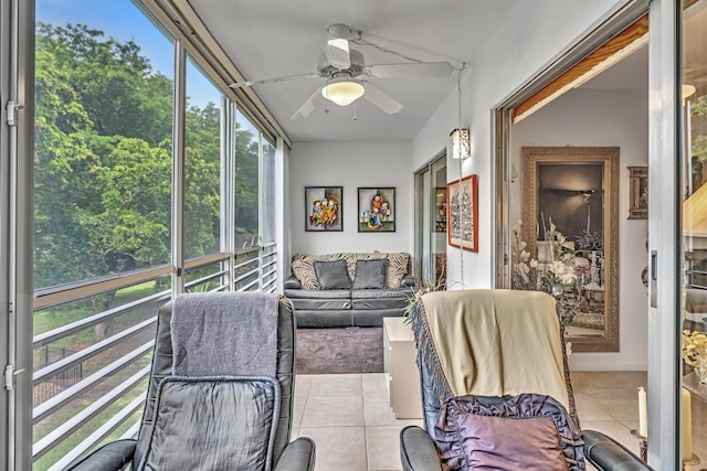 sunroom / solarium featuring ceiling fan