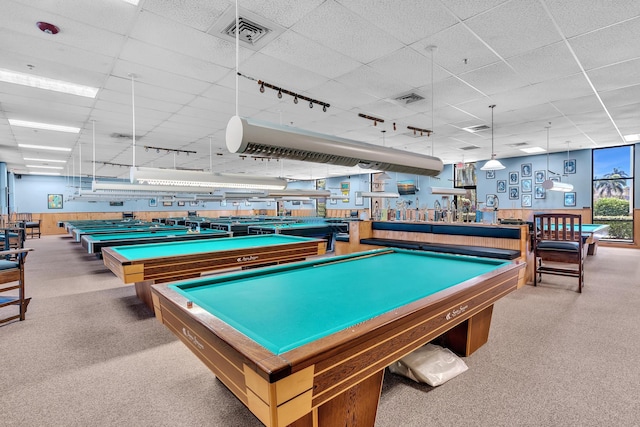 game room with carpet floors, pool table, and a drop ceiling