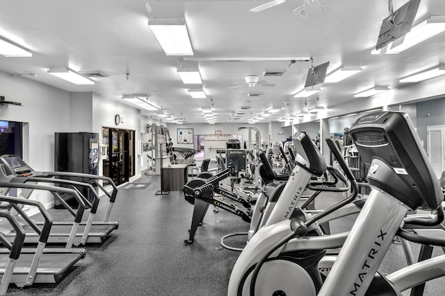 exercise room with ceiling fan