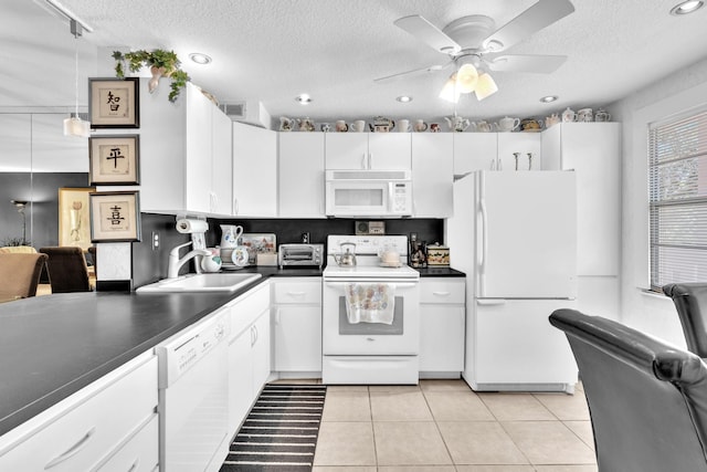 kitchen with a textured ceiling, white appliances, sink, white cabinetry, and ceiling fan