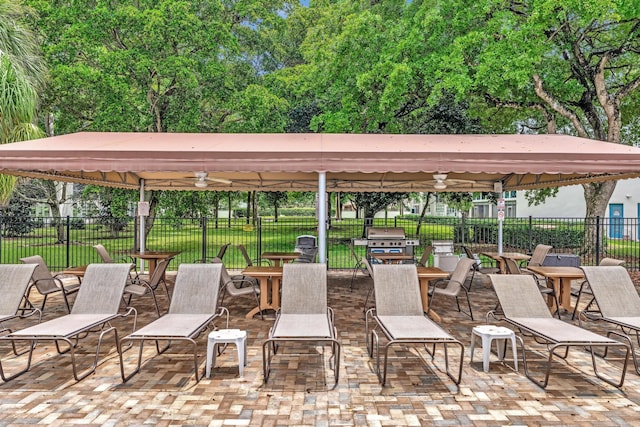 view of patio / terrace featuring a grill and ceiling fan