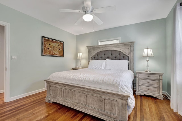 bedroom with ceiling fan and hardwood / wood-style floors