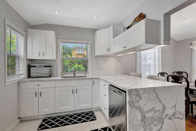 kitchen featuring sink, decorative backsplash, dishwasher, and white cabinetry