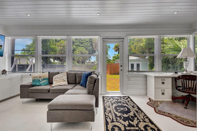 sunroom featuring wood ceiling and plenty of natural light