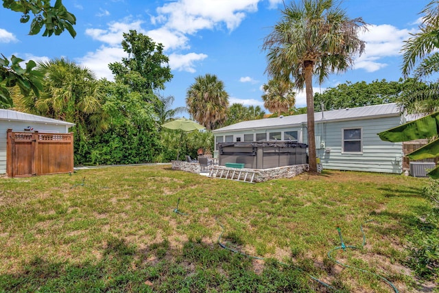 view of yard featuring a jacuzzi