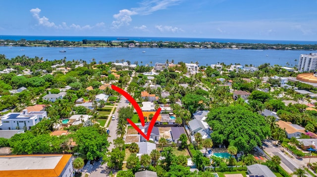 birds eye view of property with a water view