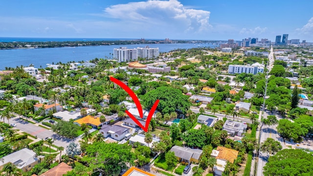 birds eye view of property featuring a water view