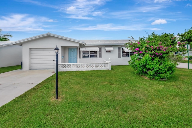 ranch-style home with a garage and a front yard