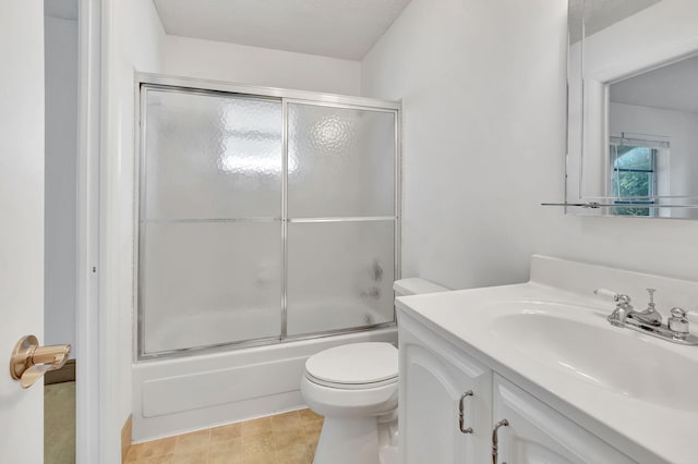 full bathroom featuring enclosed tub / shower combo, a textured ceiling, vanity, and toilet