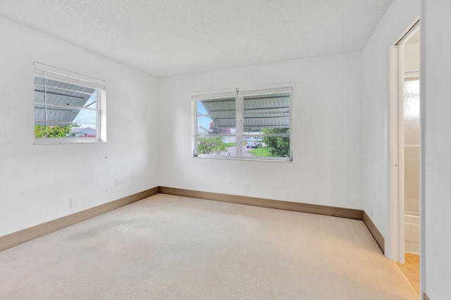 empty room with light colored carpet