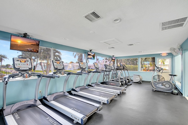 gym with a textured ceiling