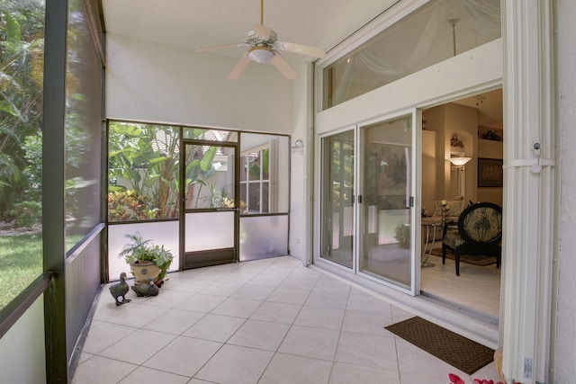 sunroom / solarium with ceiling fan and lofted ceiling