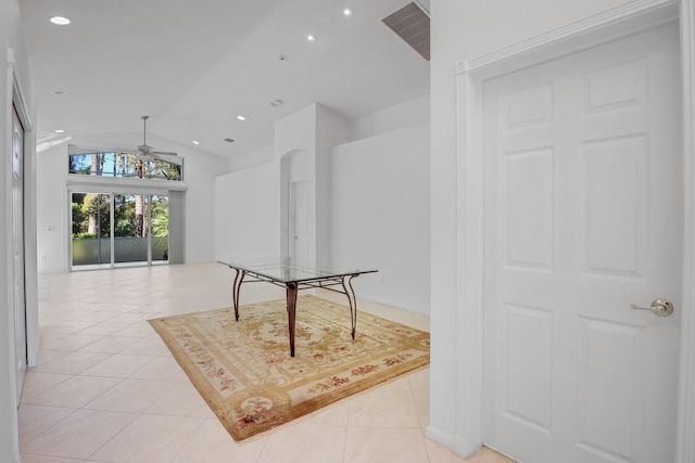 interior space featuring ceiling fan and vaulted ceiling