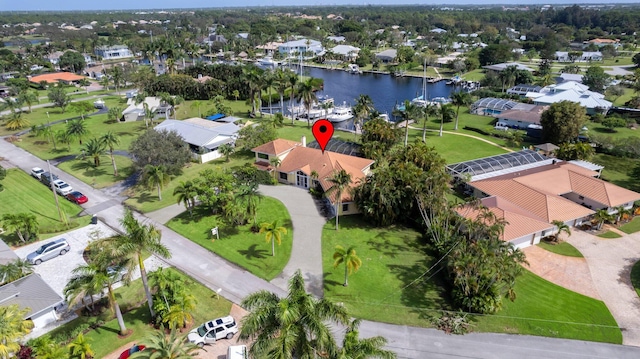 birds eye view of property with a water view