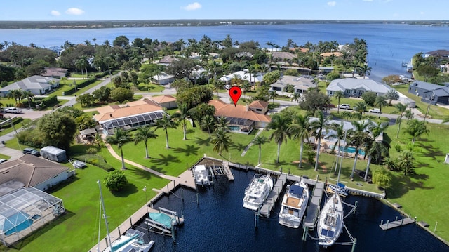 birds eye view of property featuring a water view