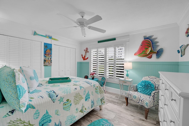 bedroom with ceiling fan, ornamental molding, and light wood-type flooring