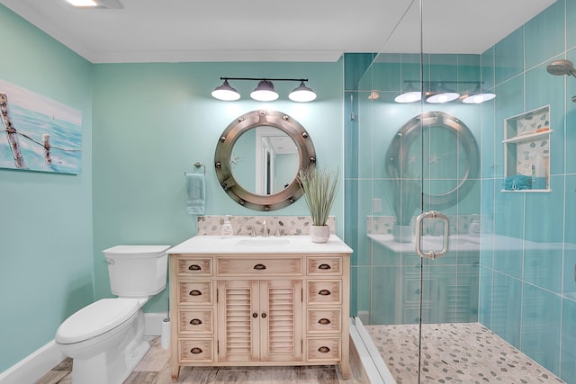 bathroom with vanity, backsplash, toilet, an enclosed shower, and wood-type flooring