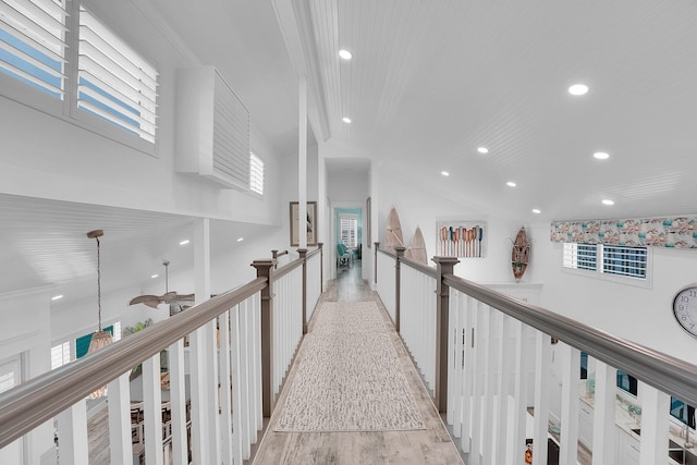 corridor featuring crown molding and light wood-type flooring