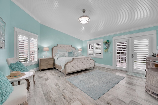 bedroom with access to exterior, crown molding, and light hardwood / wood-style floors