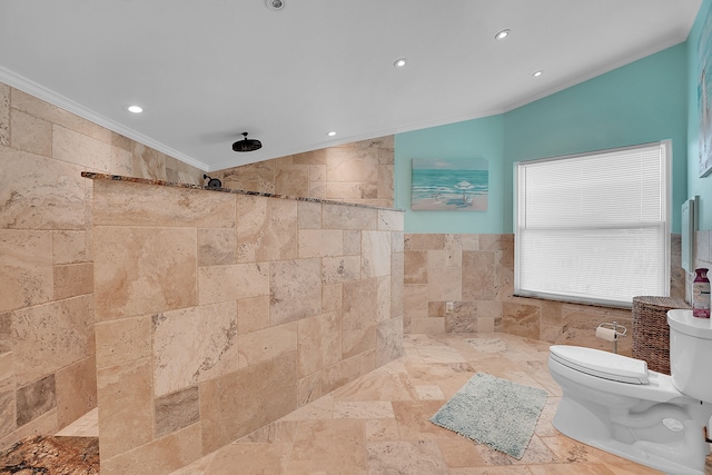 bathroom with ornamental molding, a tile shower, vaulted ceiling, tile walls, and toilet