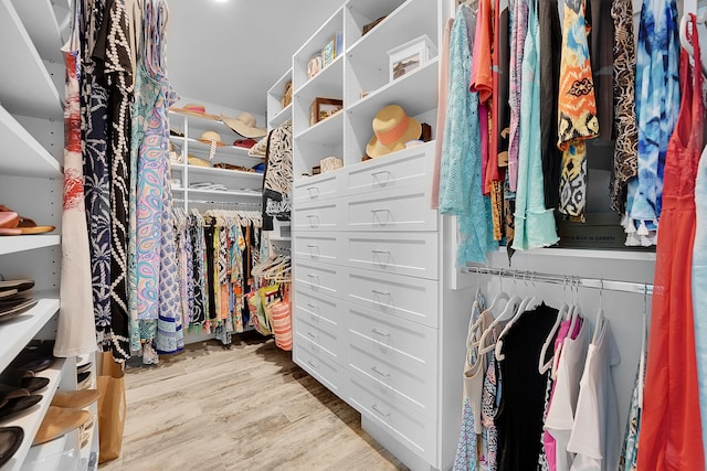 walk in closet featuring light hardwood / wood-style flooring