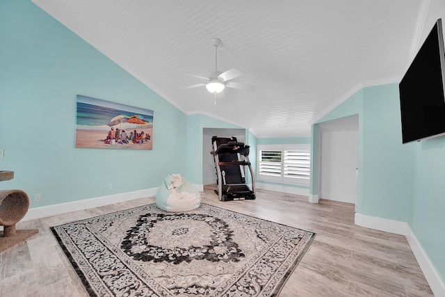 interior space featuring ceiling fan, light hardwood / wood-style floors, lofted ceiling, and ornamental molding