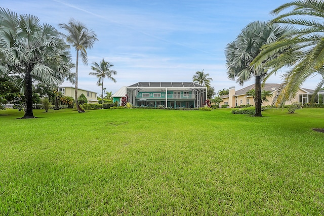 view of yard featuring a lanai