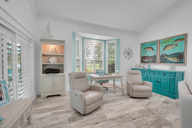 sitting room featuring light wood-type flooring and vaulted ceiling