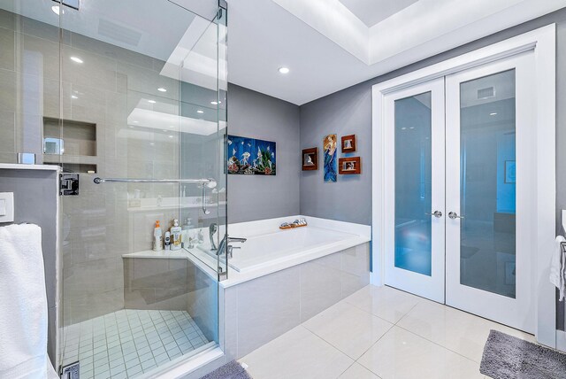 bathroom with shower with separate bathtub, french doors, and tile patterned flooring