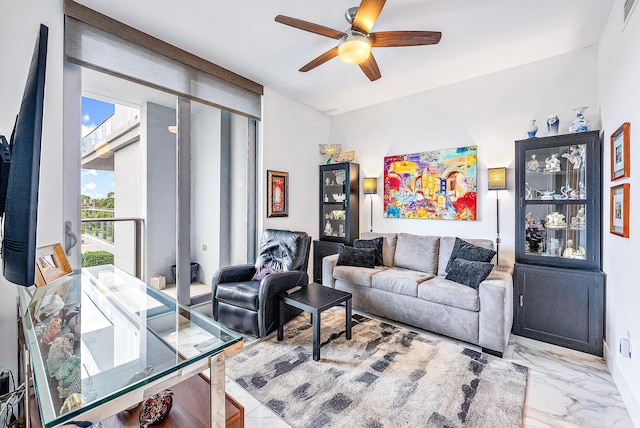 tiled living room with ceiling fan