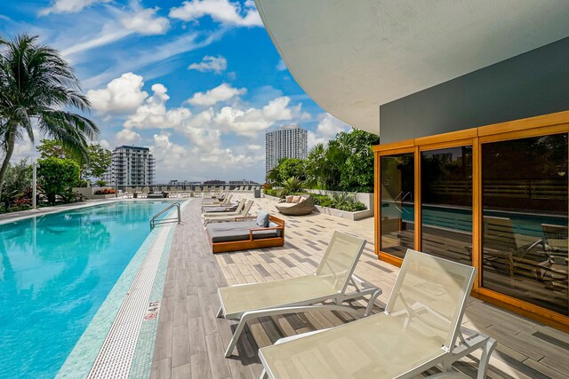 view of pool featuring a patio