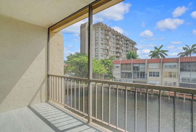 balcony featuring a water view