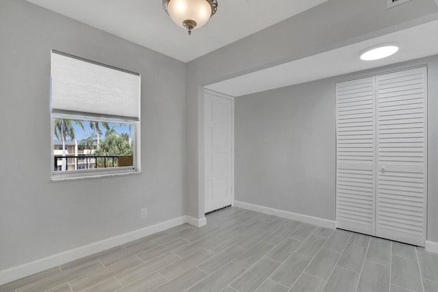 unfurnished bedroom featuring a closet