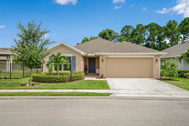 single story home with a front yard and a garage