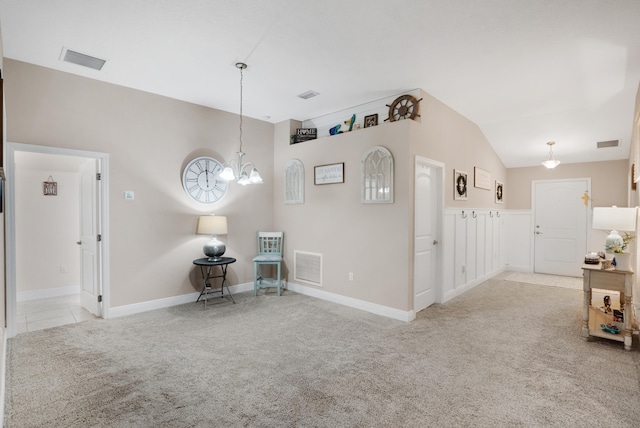 interior space featuring a chandelier and vaulted ceiling