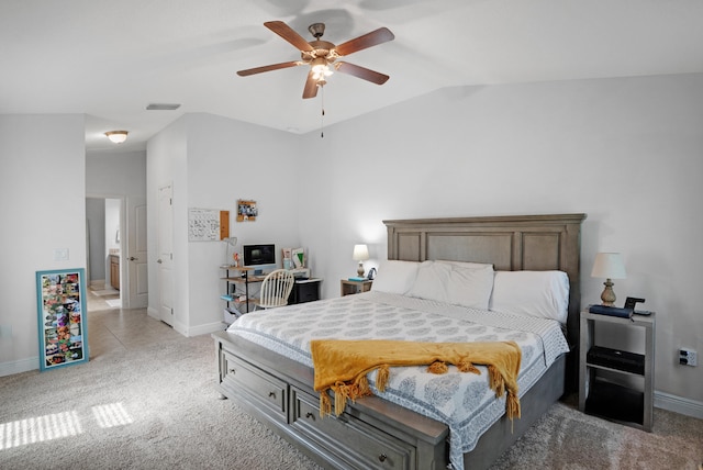 bedroom with ceiling fan, light carpet, and vaulted ceiling