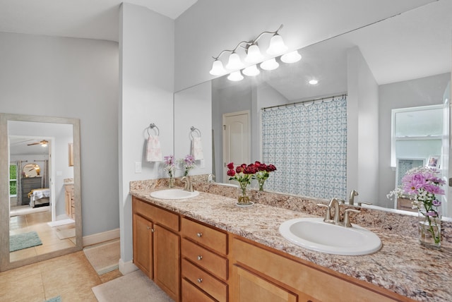 bathroom featuring vanity, ceiling fan, tile patterned floors, and a shower with curtain