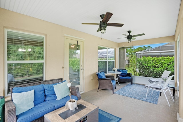 sunroom featuring ceiling fan