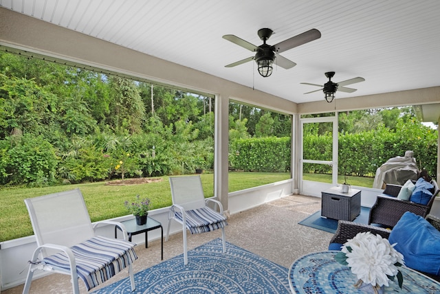 sunroom / solarium with ceiling fan