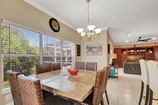 dining space featuring light tile patterned flooring, ceiling fan with notable chandelier, and crown molding