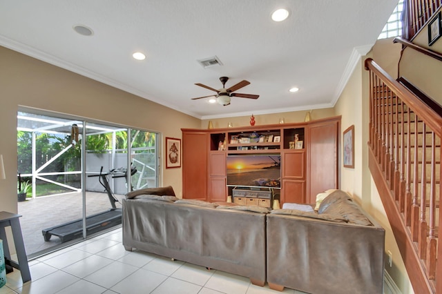 tiled living room with ceiling fan and ornamental molding