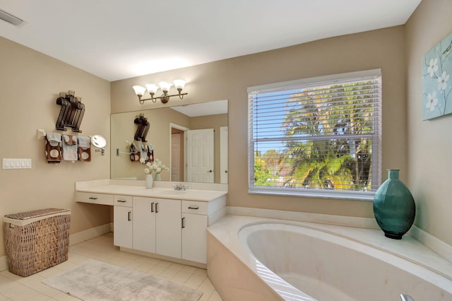 bathroom with vanity, an inviting chandelier, tile patterned flooring, visible vents, and a bath
