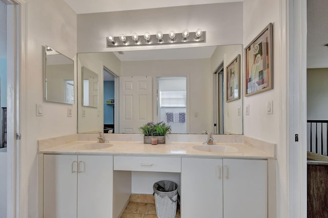 bathroom with dual vanity and tile patterned flooring